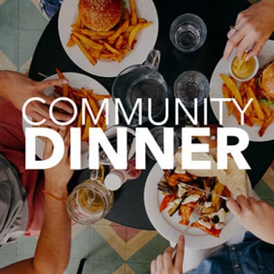 Graphic for Anderson Hills Church's Community Dinner event featuring a bird's-eye view of hands sharing a meal together