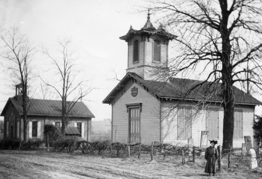 Historic black and white photo of an early Anderson Hills Church building